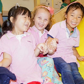 Children smiling together in the classroom